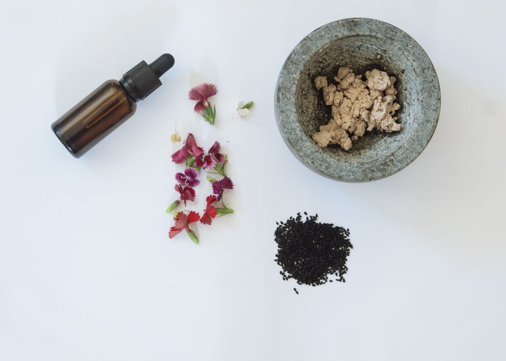 Shirley-Conlon-Organics-Organic-Skincare-Dubai-black-seeds-fresh-flowers-a-bottle-and-a-mortar
